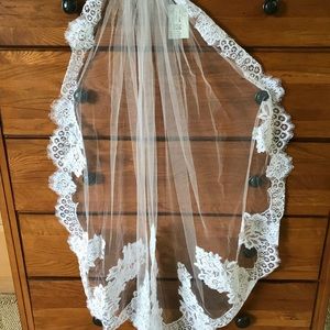 New (with tags attached) veil from David’s Bridal